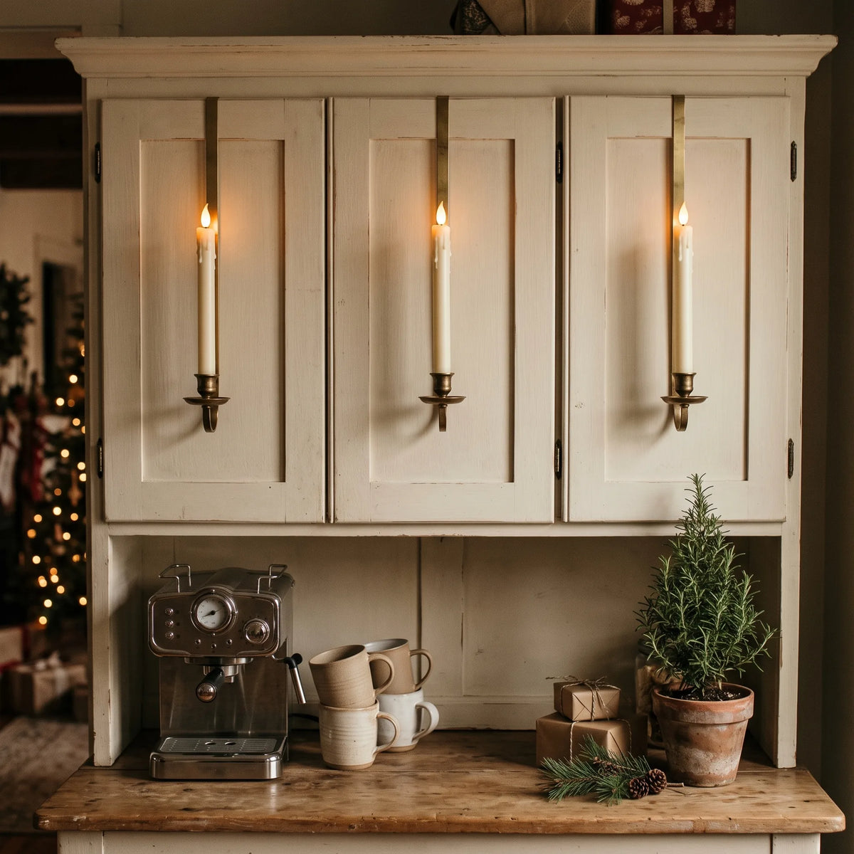 Coffee bar hutch decorated for the holidays with cabinet candles