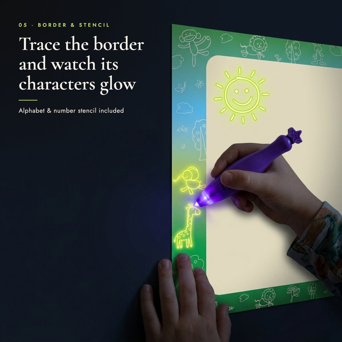 Child tracing the illustrated border of the glow canvas so its animal icons glow