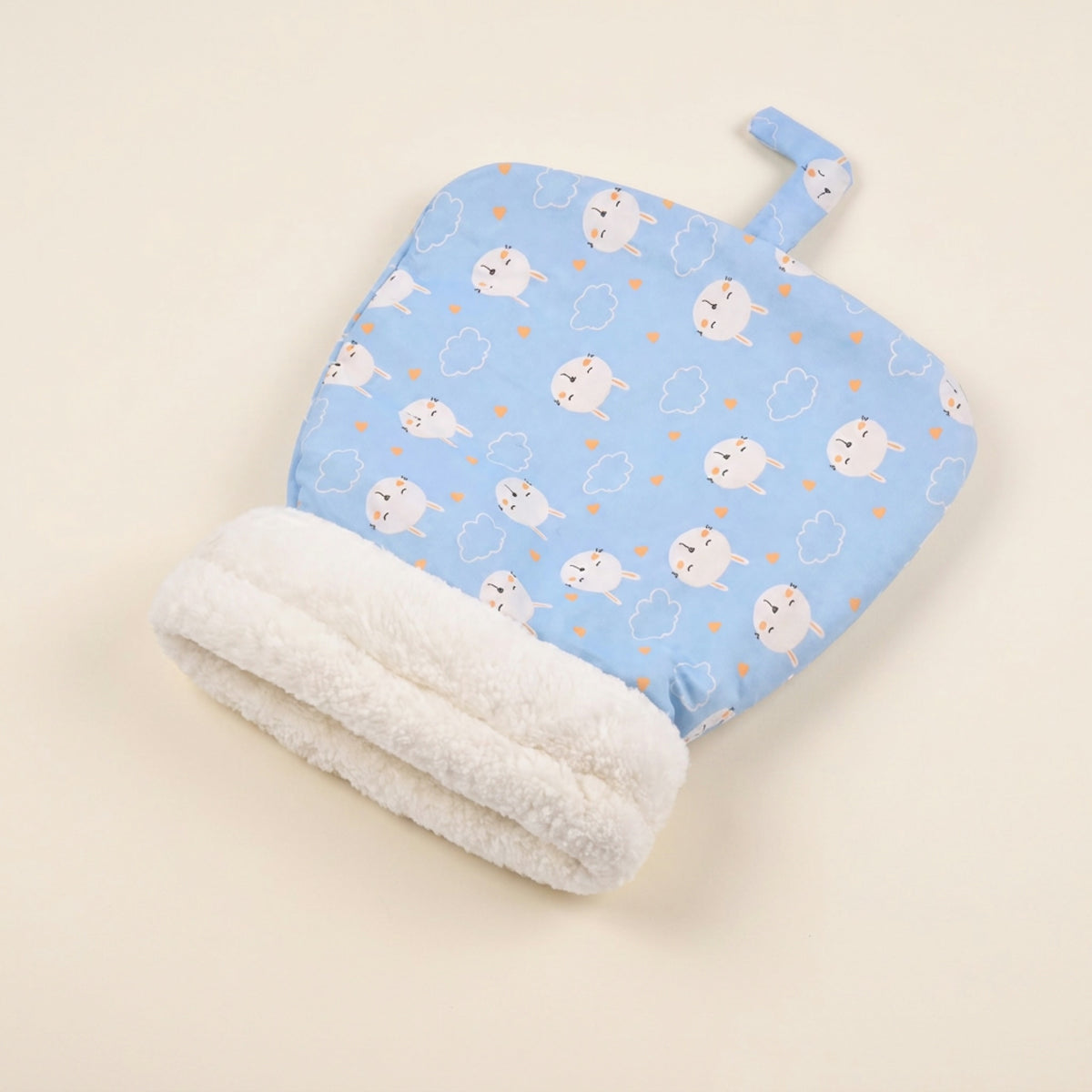 Snuggle Burrow pet sleeping bag in Sky Bunny print with rolled plush cuff opening