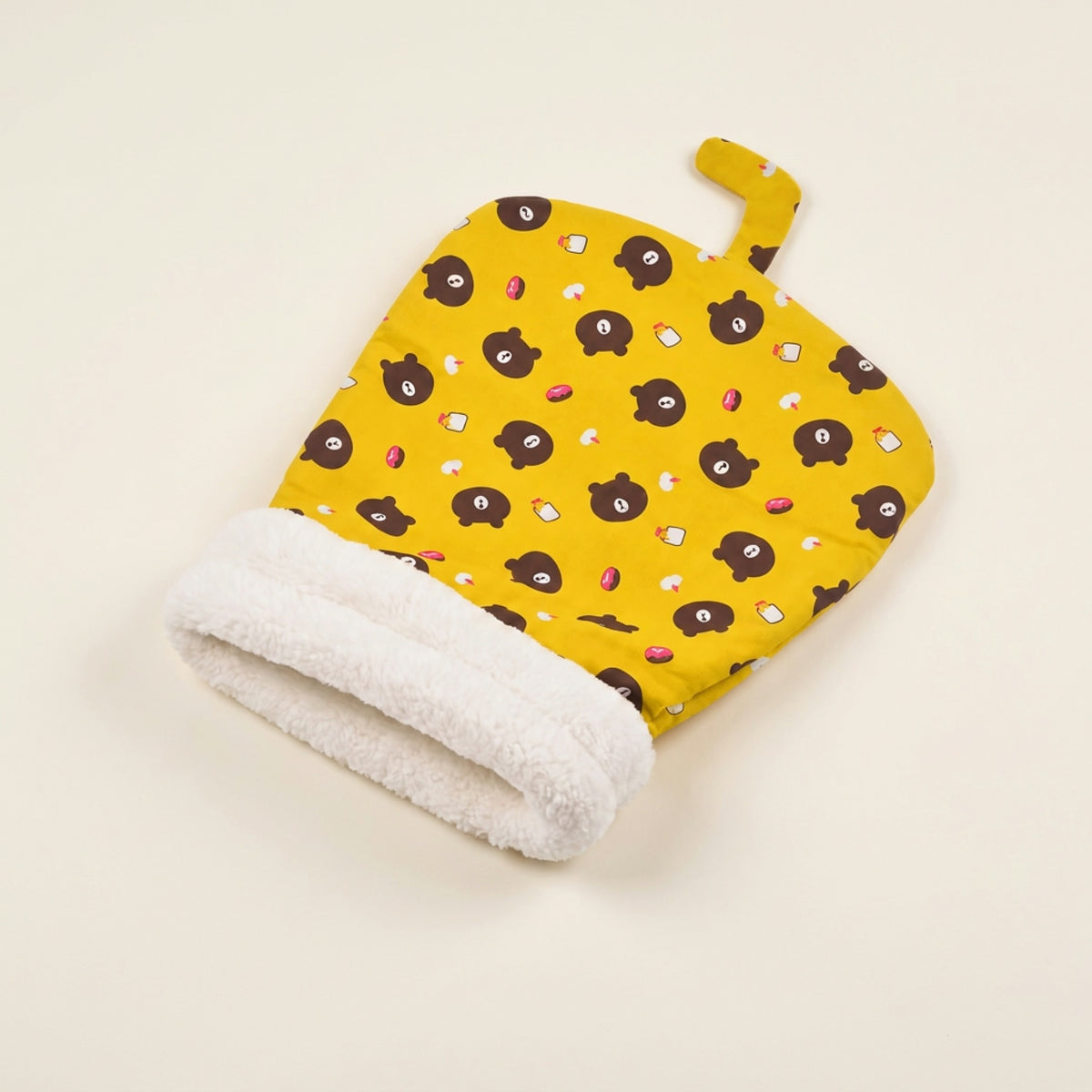 Snuggle Burrow pet sleeping bag in Honey Bear print with rolled plush cuff opening