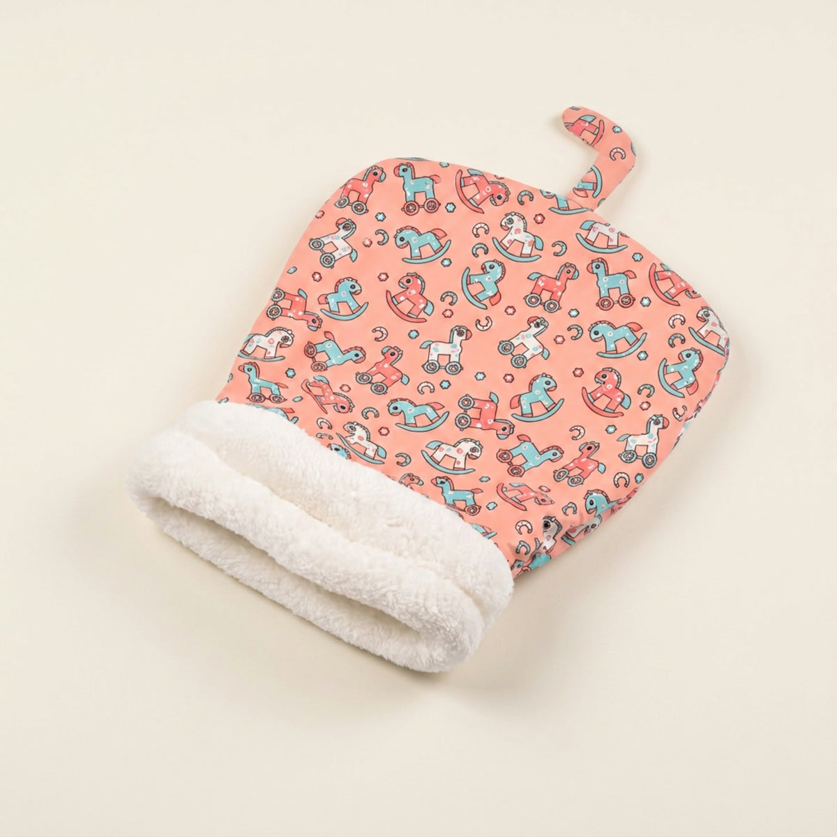 Snuggle Burrow pet sleeping bag in Coral Pony print with rolled plush cuff opening